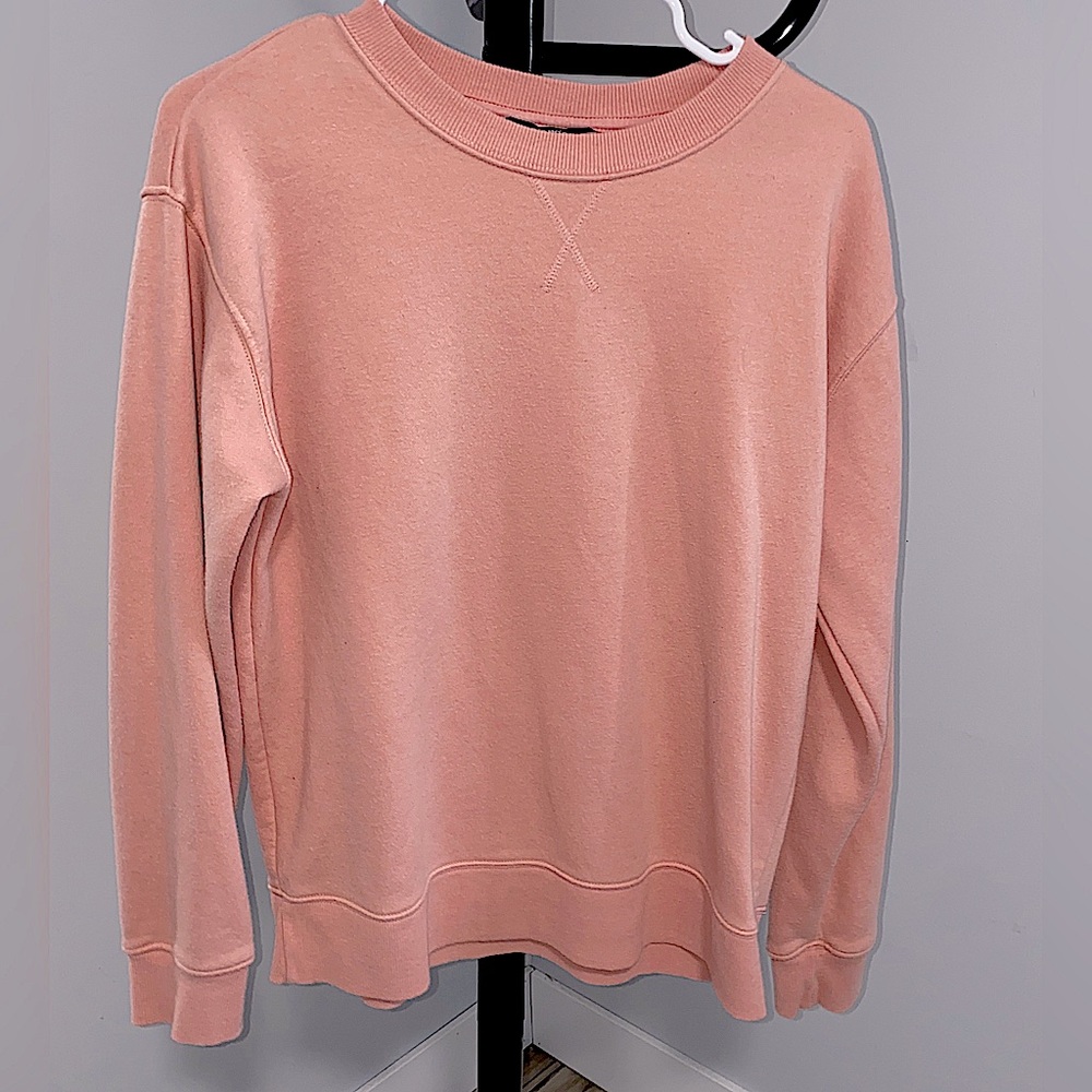 Beautiful pink crew neck sweatshirt just warm enough to keep you heated.